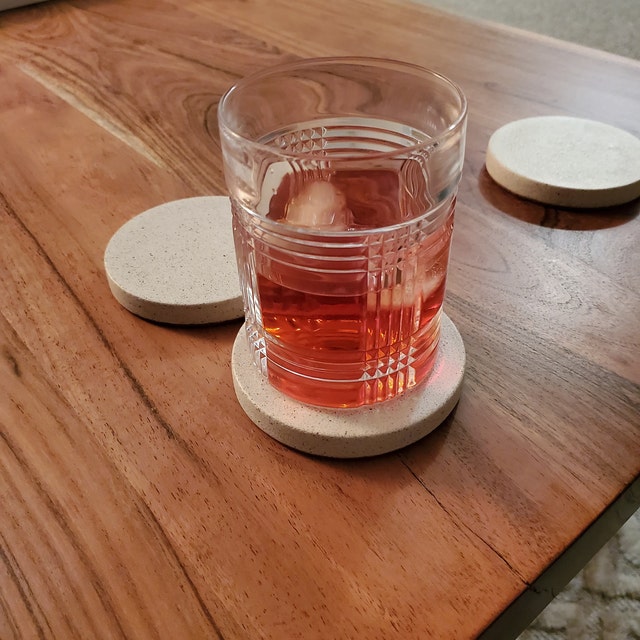 Modern White Concrete Coasters Set on Wooden Table - Chic Home Decor Accessory in Cozy Living Space