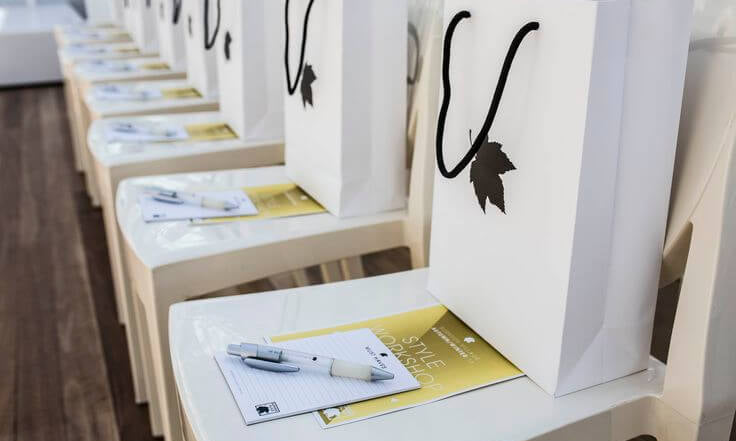 Premium Event Custom Swag Bags: Elegantly Presented on Chairs