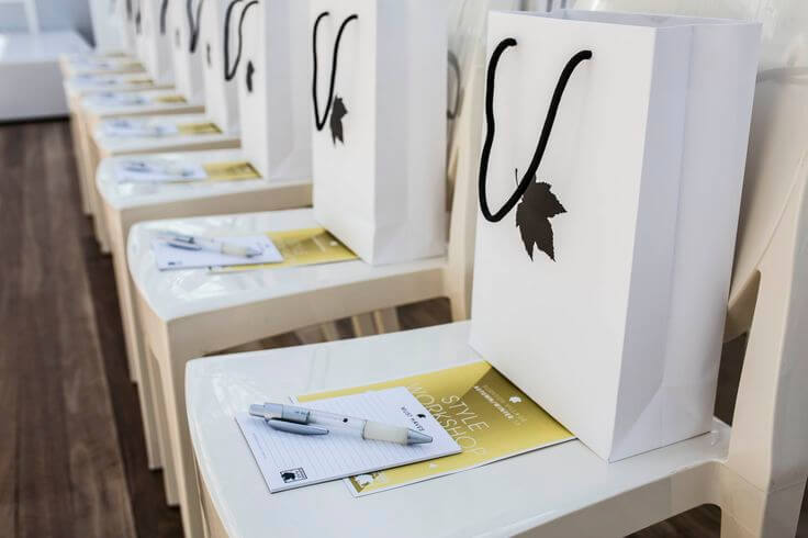 Premium Event Custom Swag Bags: Elegantly Presented on Chairs
