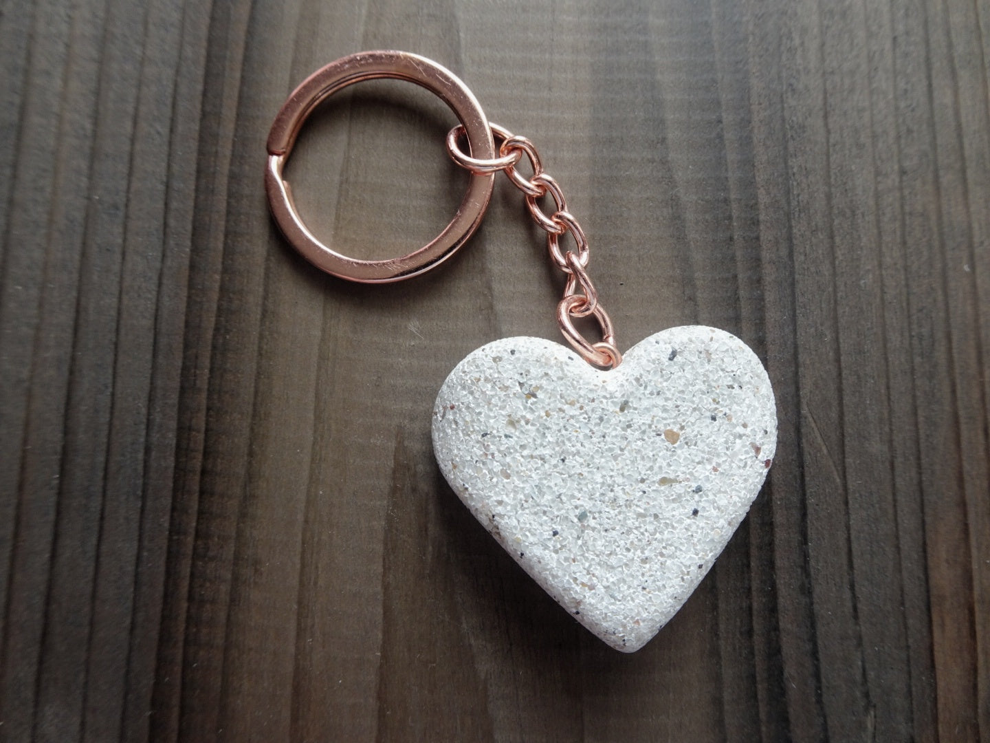Sparkling White Stone Heart-Shaped Keychain with Rose Gold Finish Displayed on Dark Stained Board - Elegant Accessory