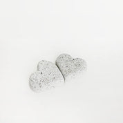 Two sparkling white sandstone hearts displayed side by side with a white background.