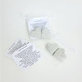 Two stone hearts and notes in a translucent silver baggie, embodying gratitude. Below, another set of stone hearts and notes, highlighting the act of sharing appreciation and love.