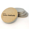 Four grey sandstone stone beverage, coffee coasters with a cork bottom - Made in Canada with an engraving on the cork that reads "Handmade by Canadian HandCrafted"