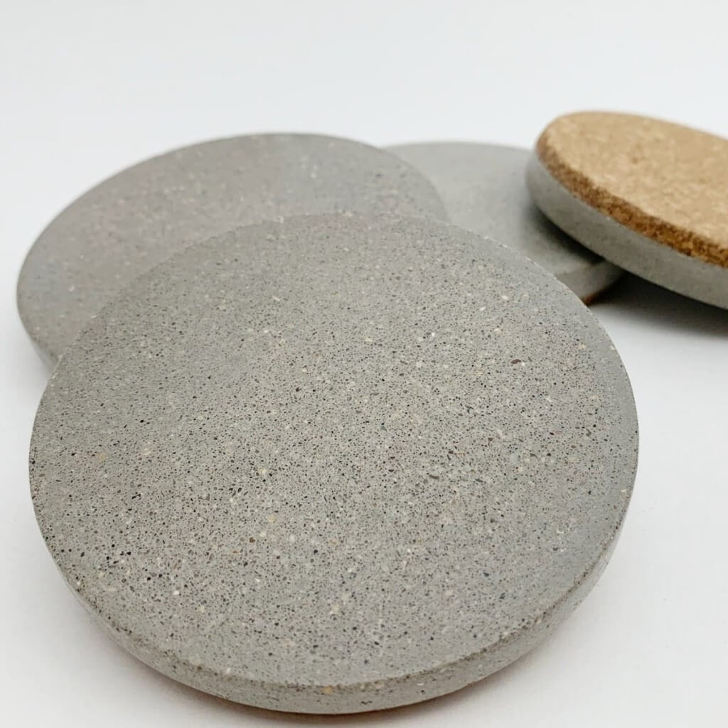 Handcrafted grey sandstone drink coasters with cork base, made in Canada - ideal for coffee and beverages