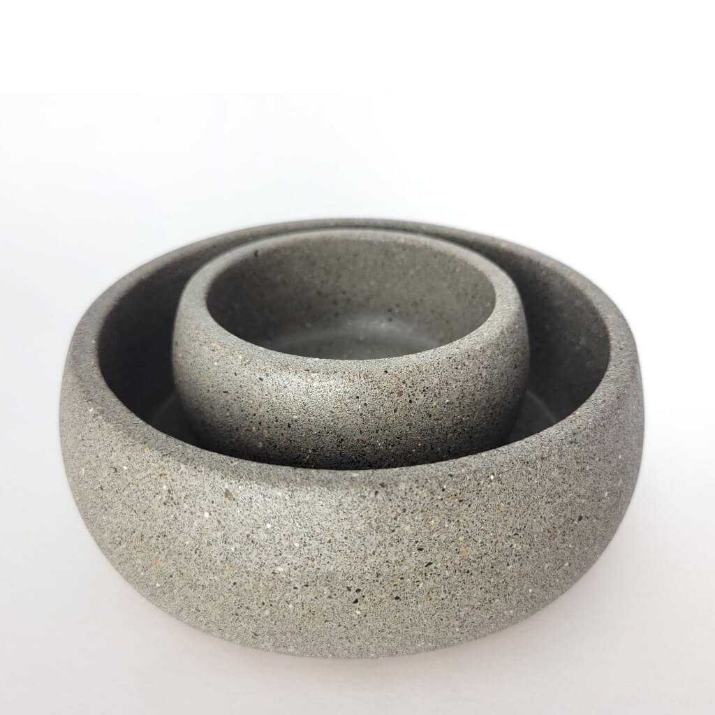 Grey stone bowl centerpiece set one small stone bowl inside a larger stone bowl.