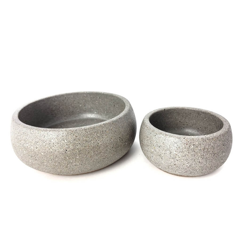 Two grey sandstone centerpiece bowls one large one small.
